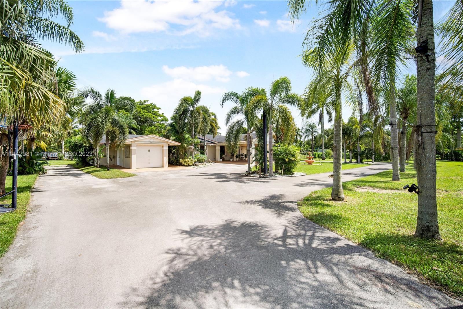 18475 Southwest 206th Street Miami, FL 33187 - Photo 7 of 49 a view of a park with palm trees