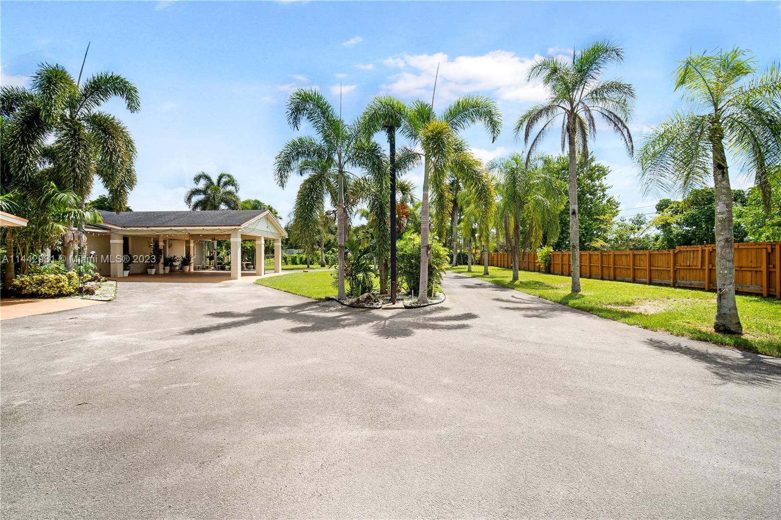 18475 Southwest 206th Street Miami, FL 33187 - Photo 9 of 49 front view of house with palm trees