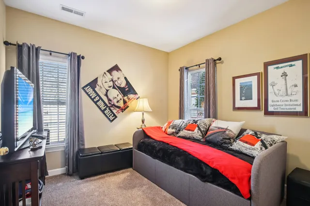 a bed room with a bed and a window