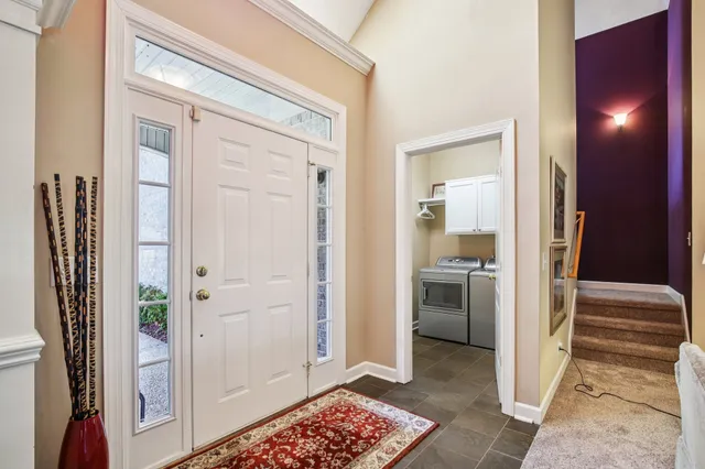 a view of a hallway and interior of the house