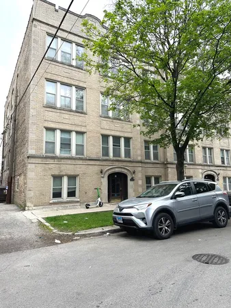 a view of a cars parked in front of a building