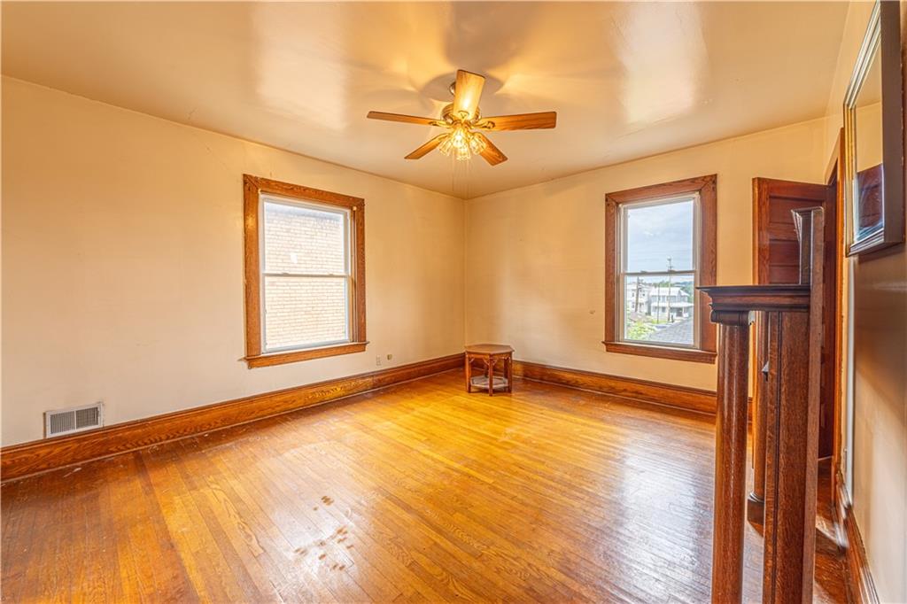 114 Union Street Uniontown, PA 15401 - Photo 14 of 28 a view of an empty room with a window and wooden floor