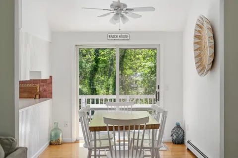 a view of a dining room with furniture window and outside view