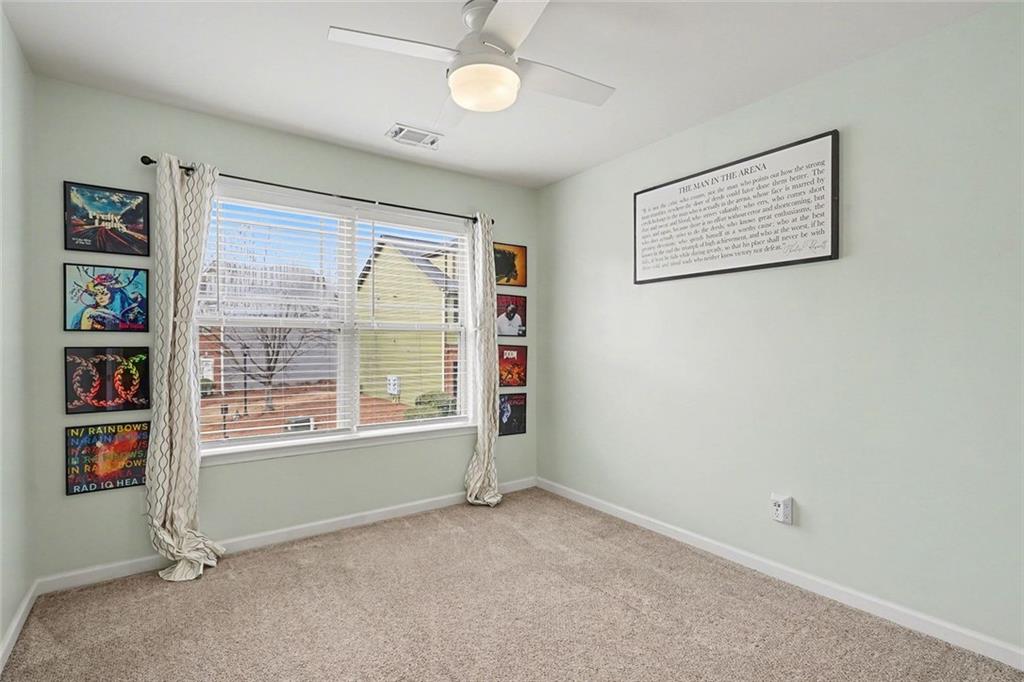 537 Ridge View Crossing Woodstock, GA 30188 - Photo 23 of 38 a view of an empty room with a window and a bookshelf