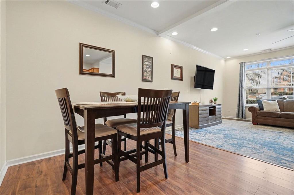 537 Ridge View Crossing Woodstock, GA 30188 - Photo 9 of 38 a view of a dining room with furniture and wooden floor