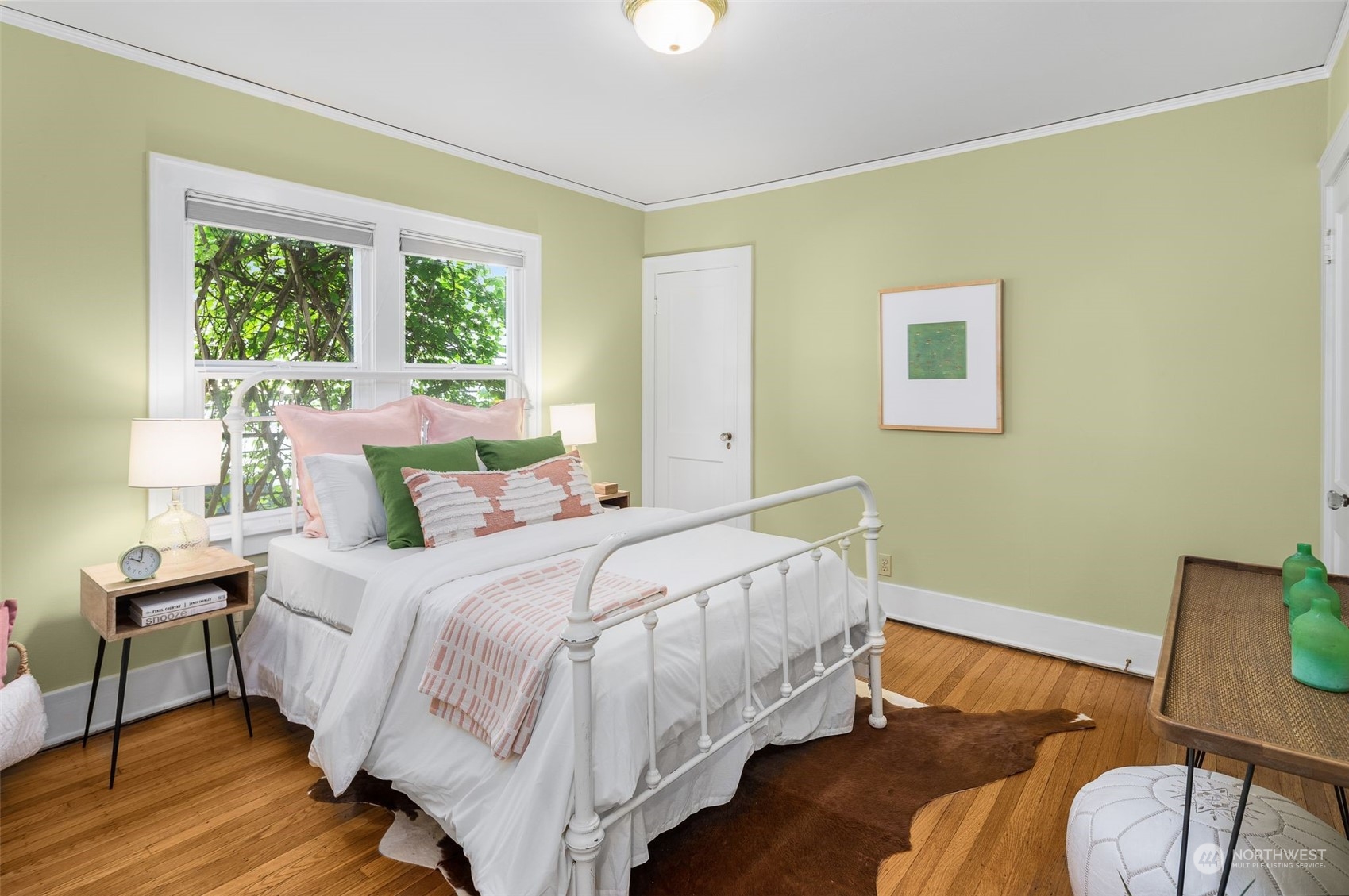 4229 Eastern Avenue North Seattle, WA 98103 - Photo 19 of 32 a bedroom with a bed and wooden floor