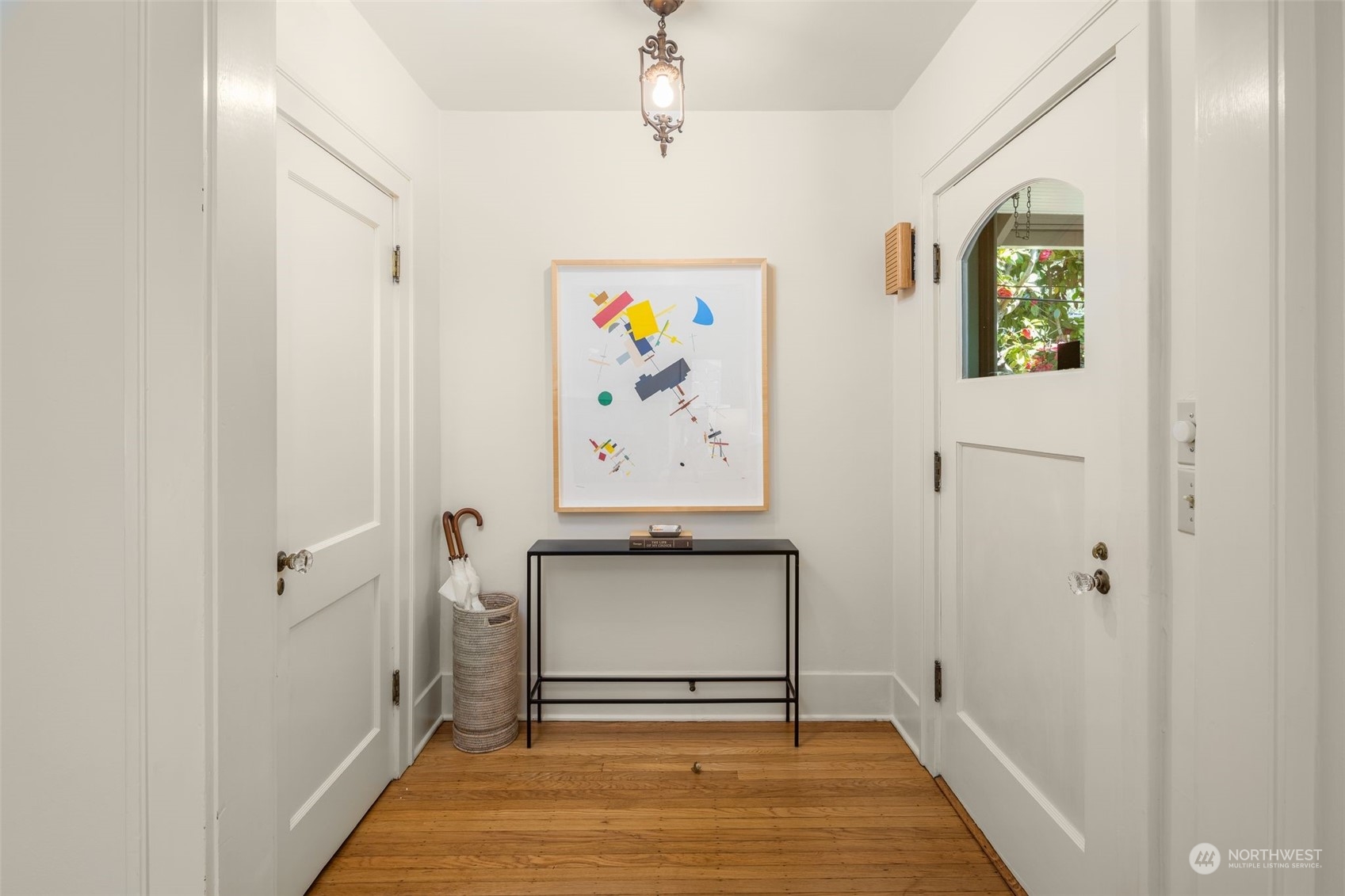 4229 Eastern Avenue North Seattle, WA 98103 - Photo 2 of 32 a view of a hallway with wooden floor and entryway