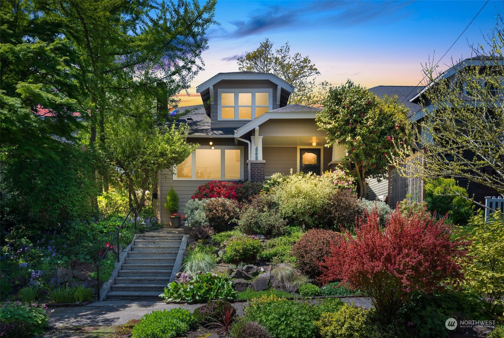 4229 Eastern Avenue North Seattle, WA 98103 - Photo 32 of 32 a front view of a house with a yard and fountain in middle