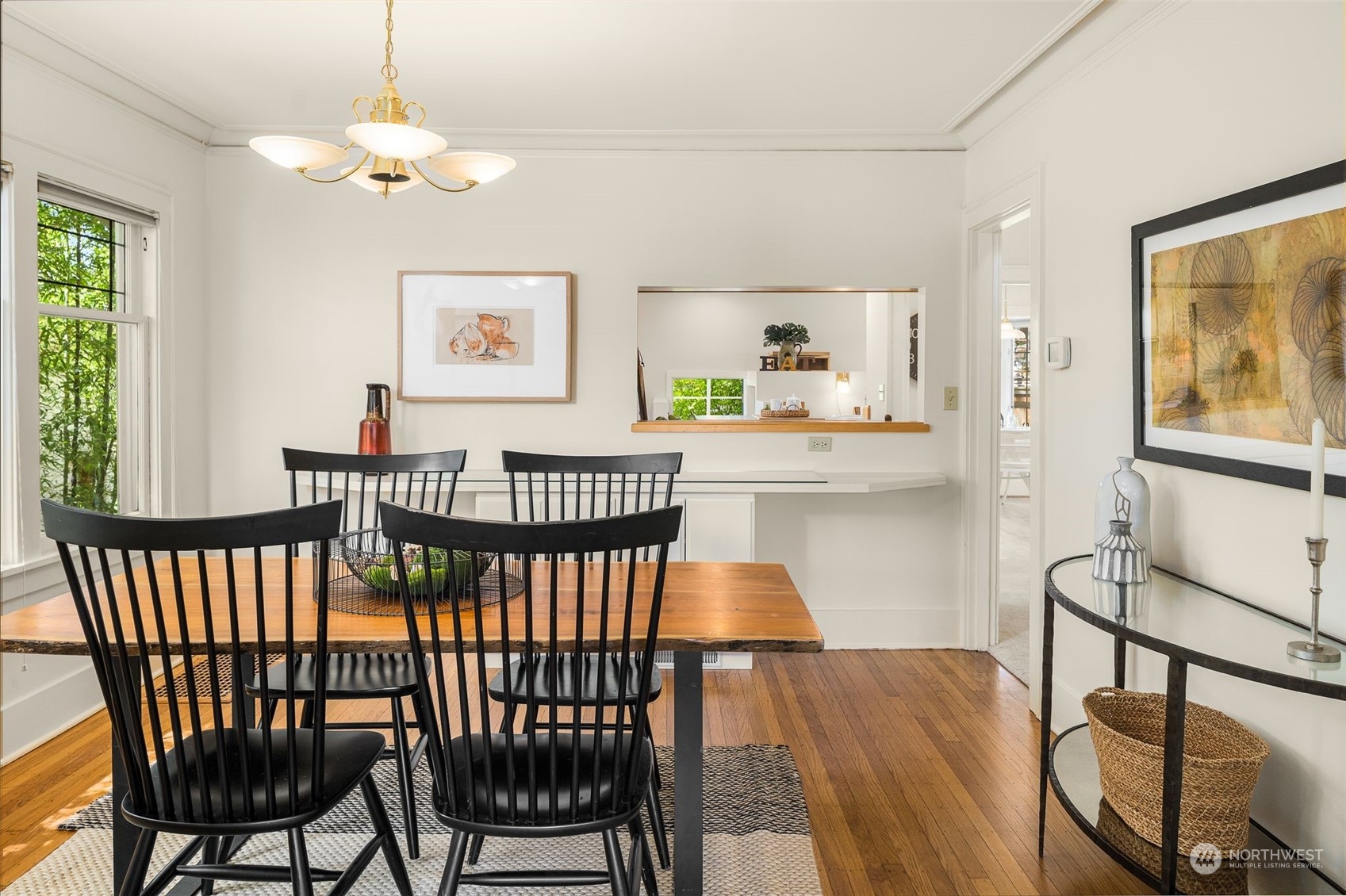 4229 Eastern Avenue North Seattle, WA 98103 - Photo 5 of 32 a view of a dining room with furniture a chandelier and wooden floor