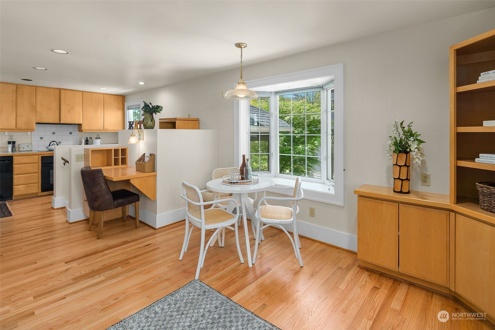 4229 Eastern Avenue North Seattle, WA 98103 - Photo 9 of 32 a view of a dining room with furniture window and wooden floor