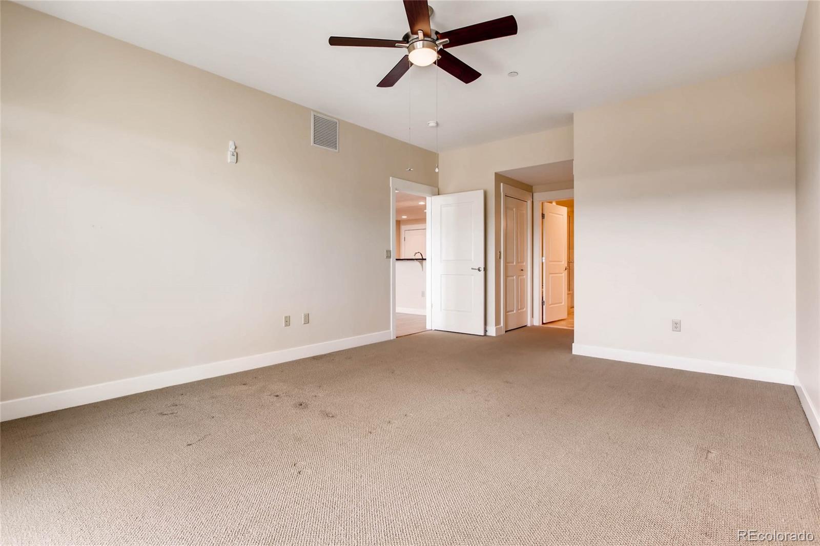 7220 W. Bonfils Lane, Unit 410 Lakewood, CO 80226 - Photo 16 of 27 wooden floor in an empty room