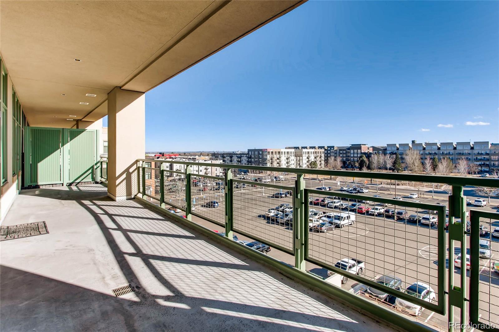 7220 W. Bonfils Lane, Unit 410 Lakewood, CO 80226 - Photo 23 of 27 a view of a balcony with wooden floor