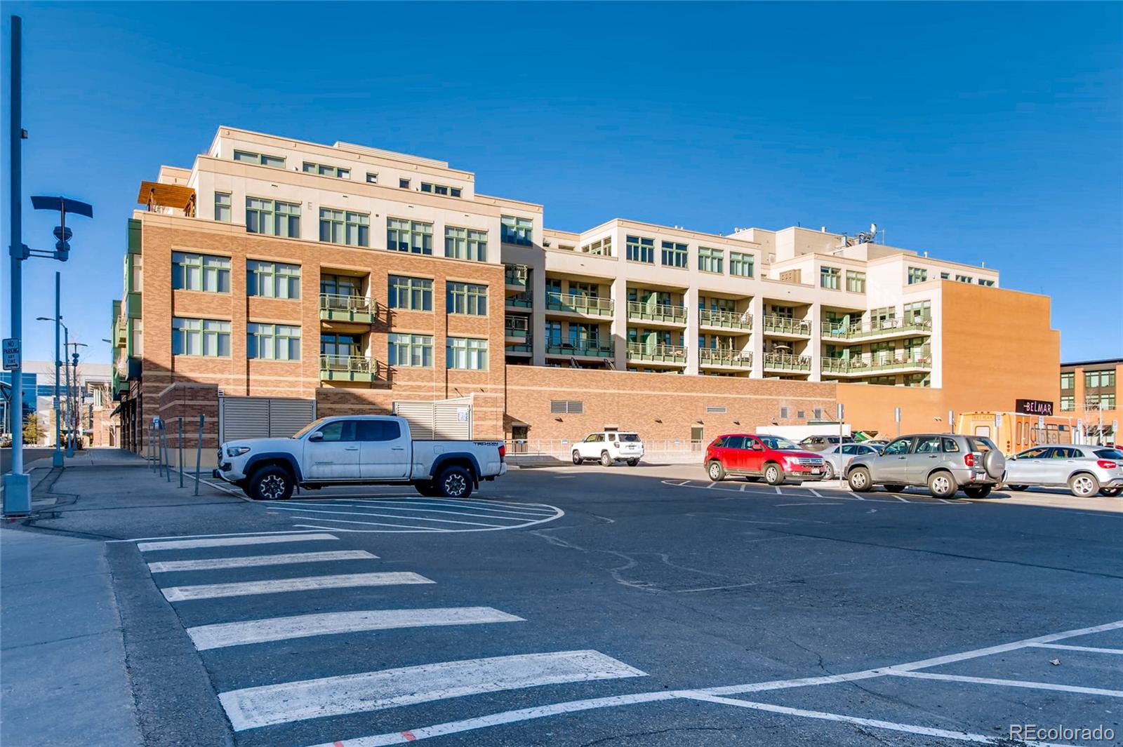 7220 W. Bonfils Lane, Unit 410 Lakewood, CO 80226 - Photo 25 of 27 a front view of a building with street view and building