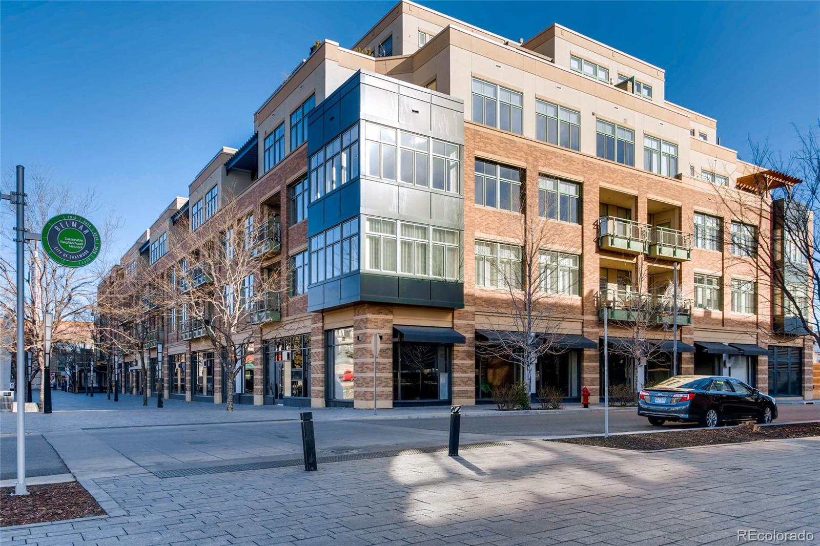 7220 W. Bonfils Lane, Unit 410 Lakewood, CO 80226 - Photo 3 of 27 a front view of a building with street