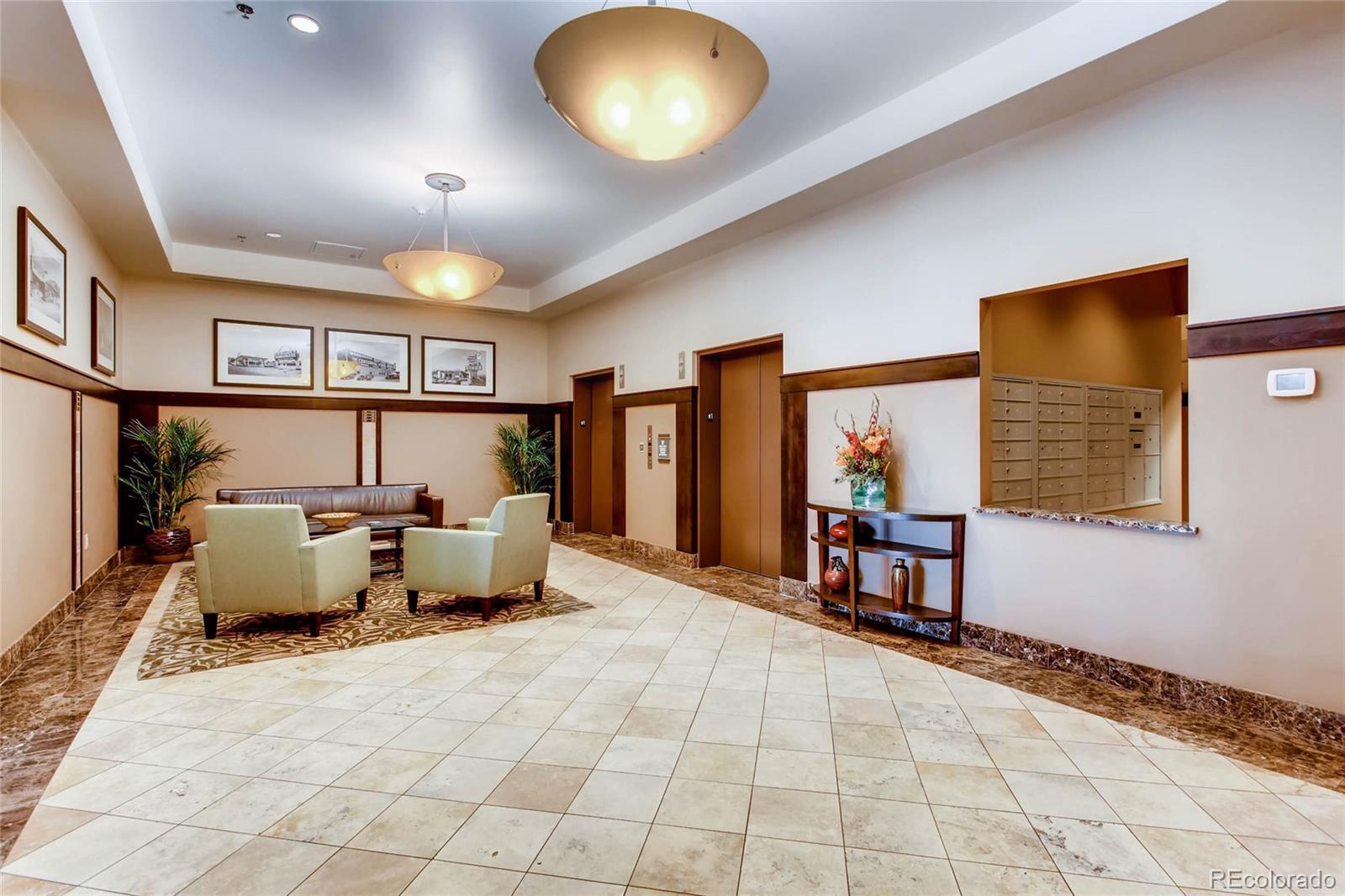 7220 W. Bonfils Lane, Unit 410 Lakewood, CO 80226 - Photo 5 of 27 a bed room with a bed and a large window