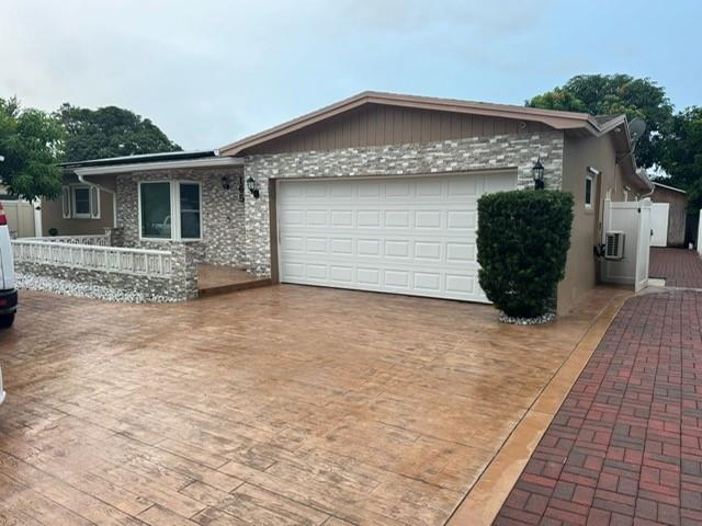 a front view of a house with parking space