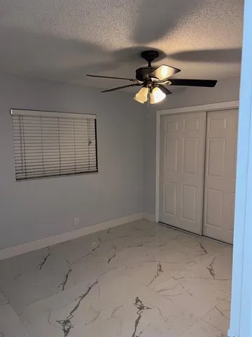 a view of a chandelier fan in a room