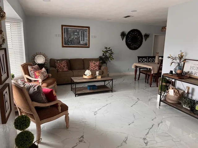 a living room with furniture and a window