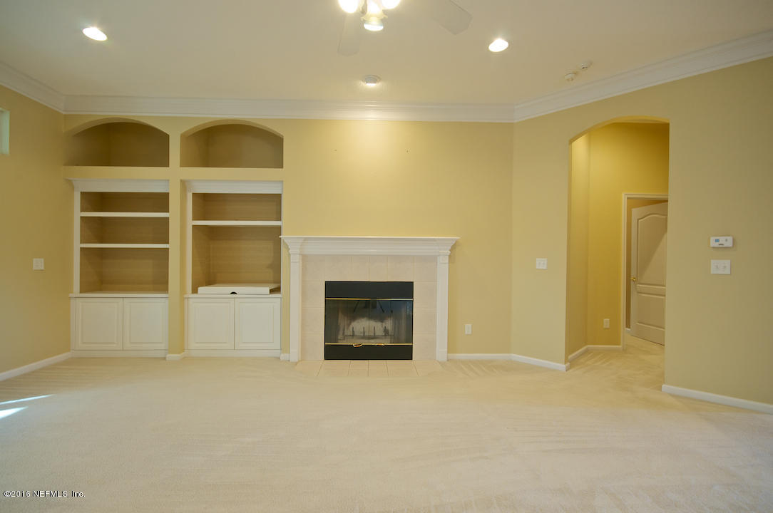 473 Big Tree Road Ponte Vedra Beach, FL 32082 - Photo 3 of 21 a view of a room with a fireplace and cabinet
