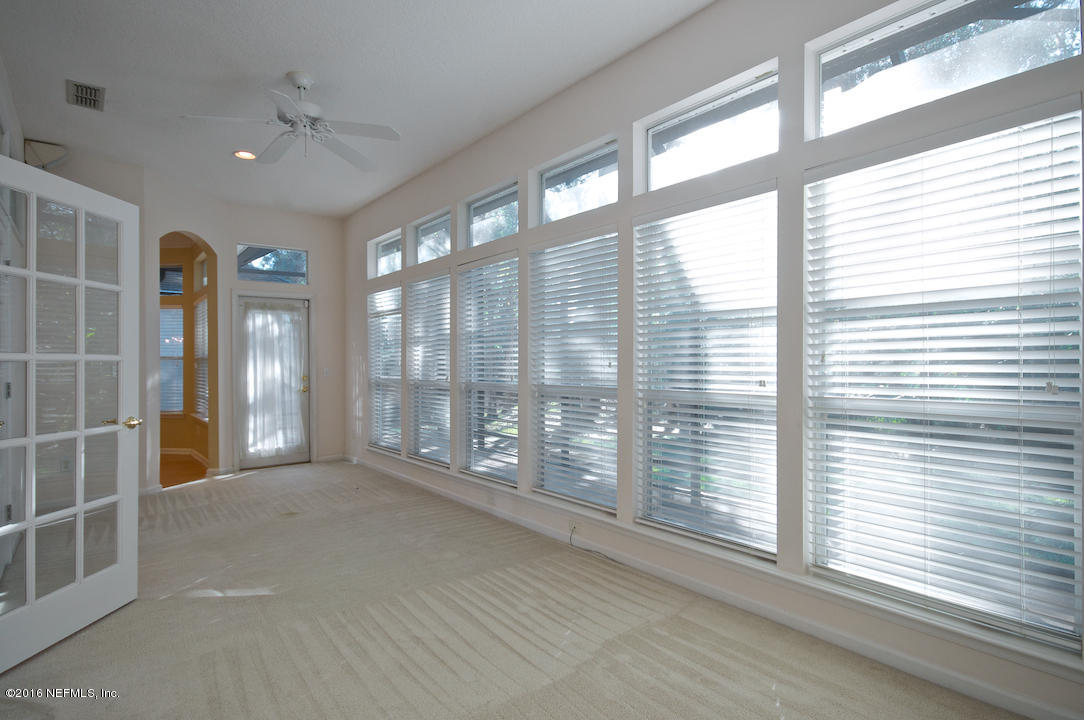 473 Big Tree Road Ponte Vedra Beach, FL 32082 - Photo 9 of 21 a view of an empty room with windows and a balcony