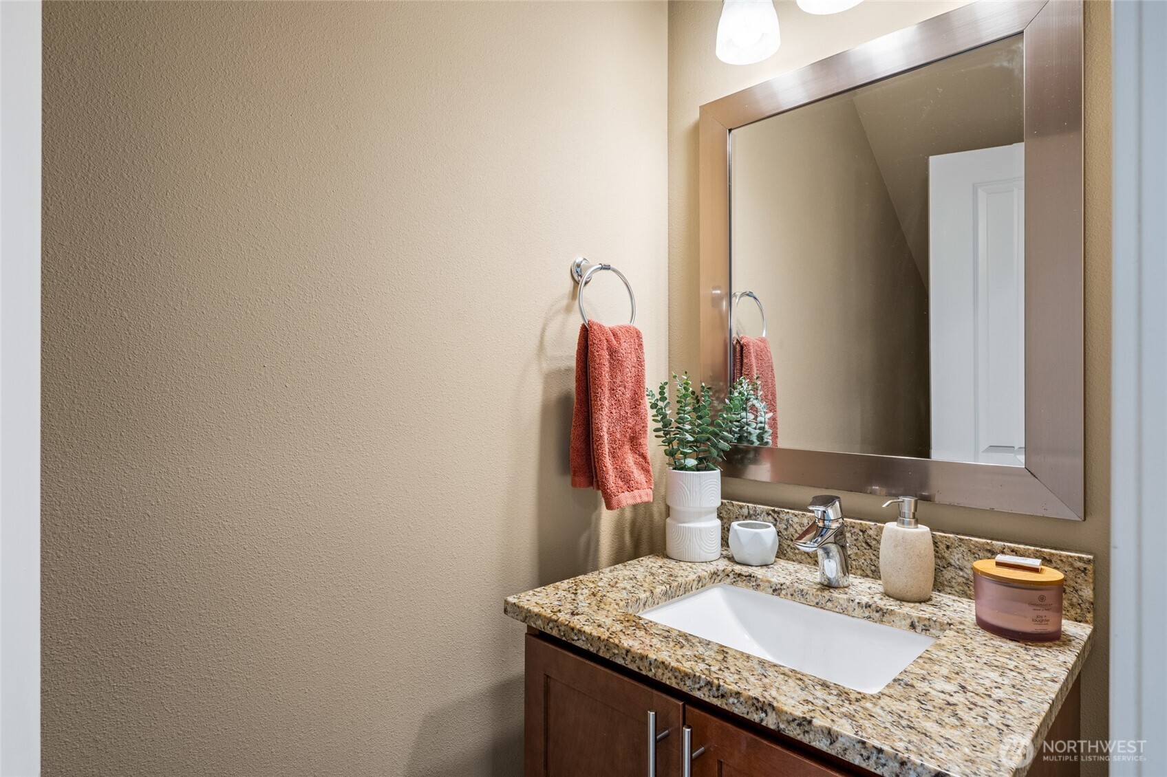 3013 South Nevada Street Seattle, WA 98108 - Photo 13 of 33 a bathroom with a granite countertop sink a toilet and a mirror