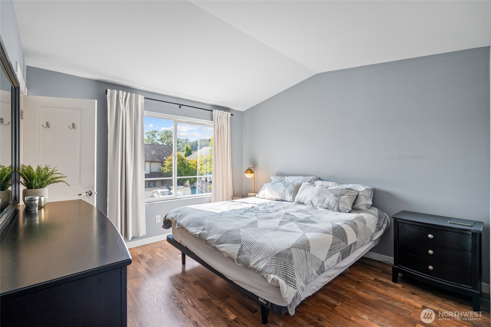 3013 South Nevada Street Seattle, WA 98108 - Photo 16 of 33 a bedroom with a bed and a table in it