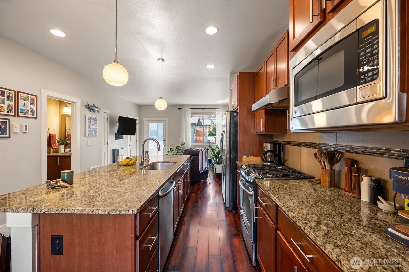 3013 South Nevada Street Seattle, WA 98108 - Photo 5 of 33 a kitchen with stainless steel appliances granite countertop a stove oven and a refrigerator