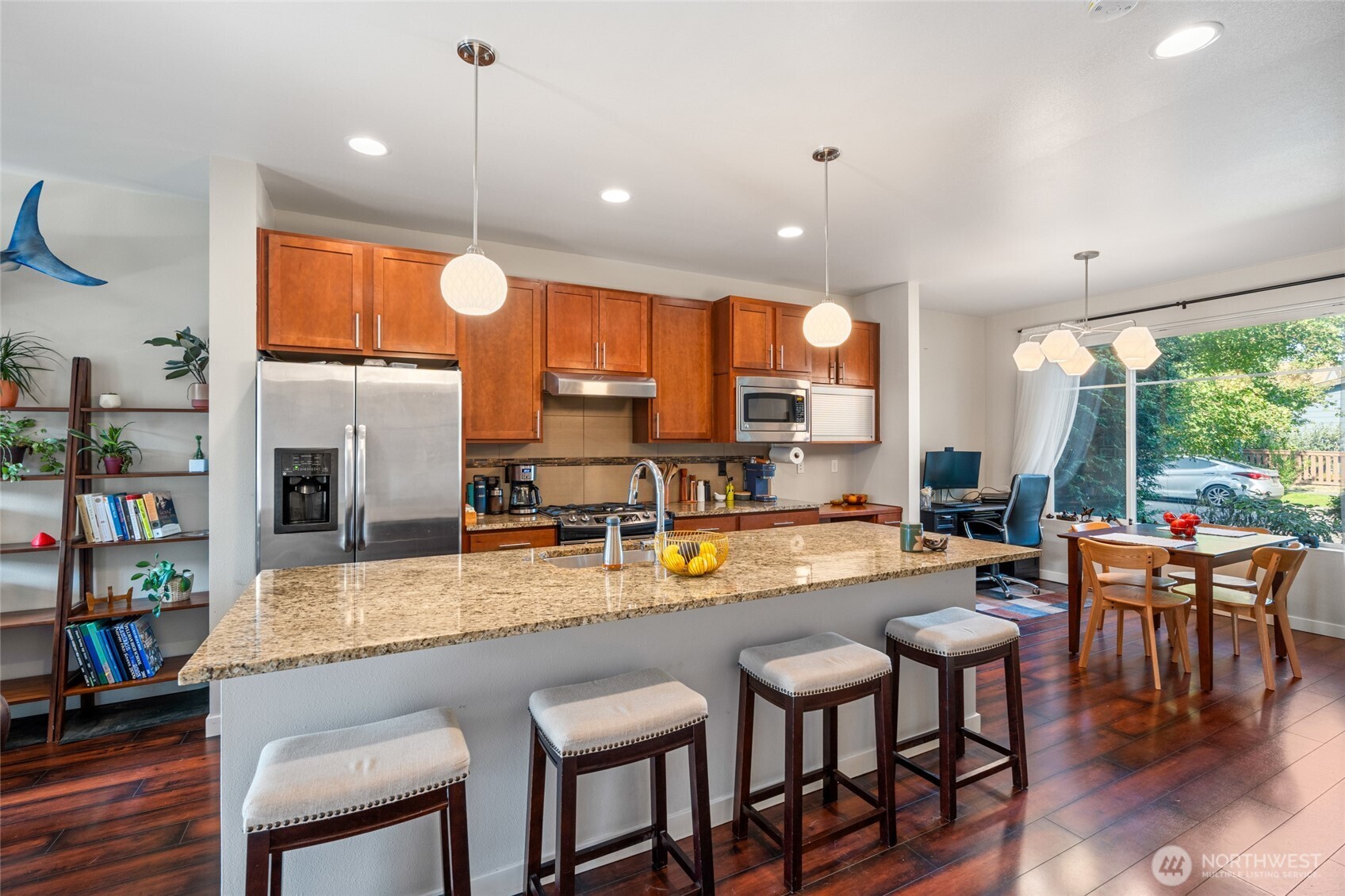3013 South Nevada Street Seattle, WA 98108 - Photo 6 of 33 a kitchen with a table chairs refrigerator and couch