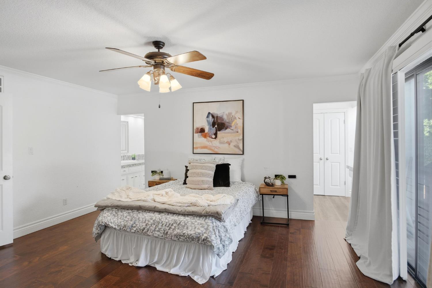10401 Golf Link Road Turlock, CA 95380 - Photo 19 of 63 a bedroom with a bed and wooden floor