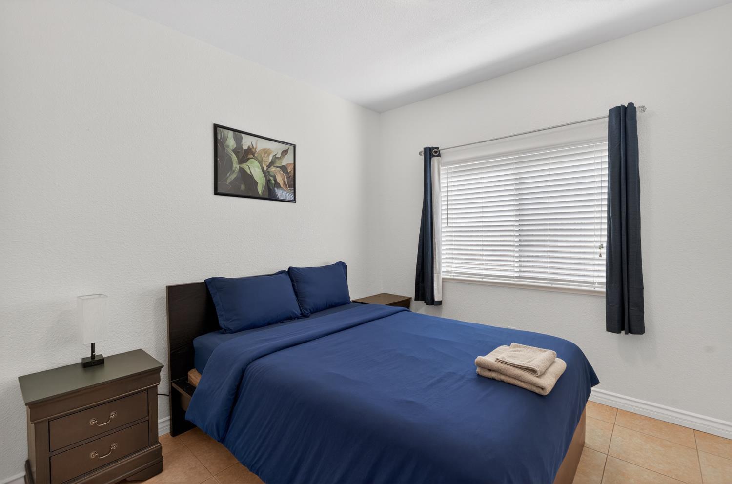 8148 Silverleaf Way Sacramento, CA 95829 - Photo 14 of 43 a bedroom with a bed and a window