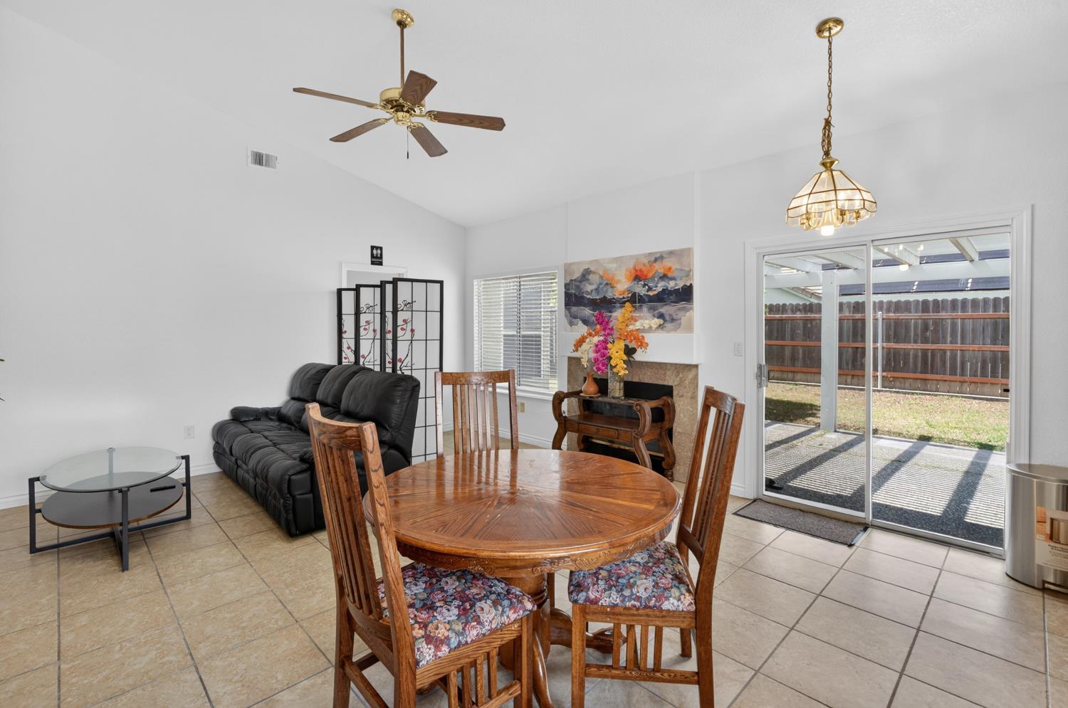 8148 Silverleaf Way Sacramento, CA 95829 - Photo 25 of 43 a dining room with furniture a chandelier and window