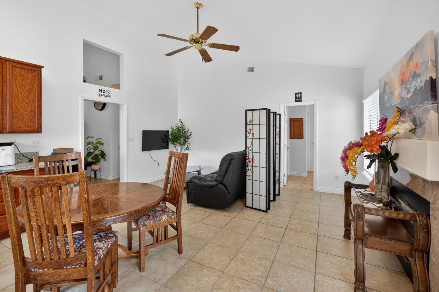 8148 Silverleaf Way Sacramento, CA 95829 - Photo 27 of 43 a dining room with furniture and a chandelier