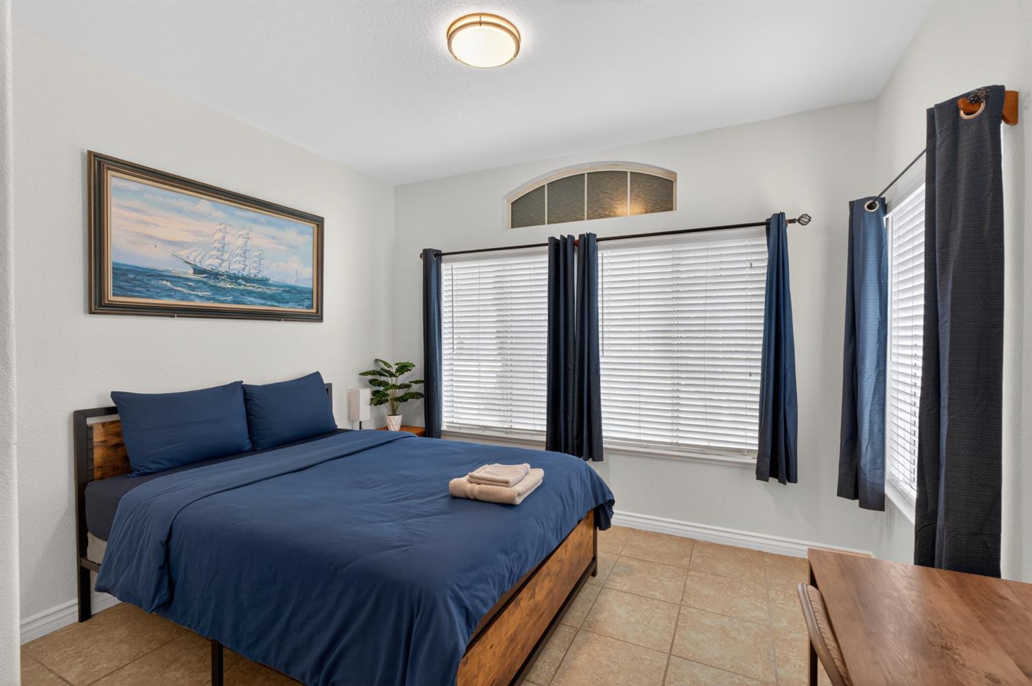 8148 Silverleaf Way Sacramento, CA 95829 - Photo 28 of 43 a bedroom with a bed and a large mirror
