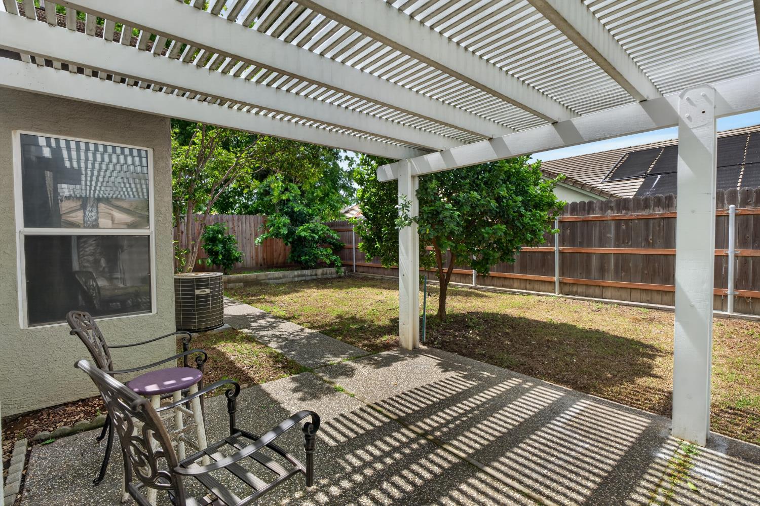 8148 Silverleaf Way Sacramento, CA 95829 - Photo 35 of 43 a view of a patio with table and chairs with wooden floor and fence