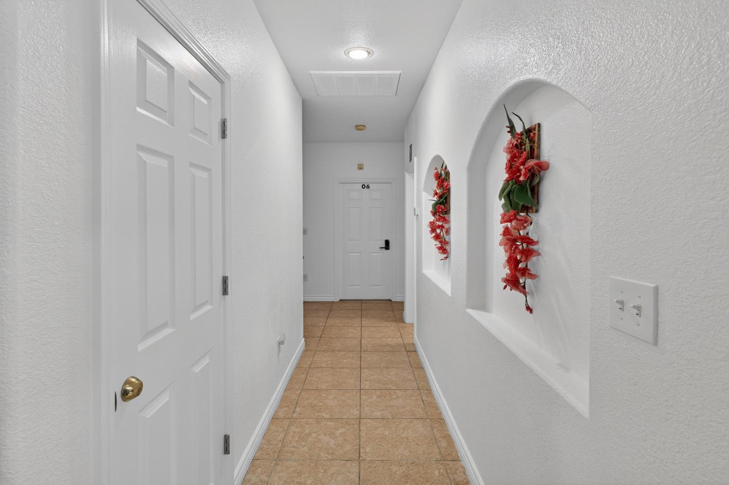 8148 Silverleaf Way Sacramento, CA 95829 - Photo 7 of 43 a view of a hallway with wooden floor and entryway