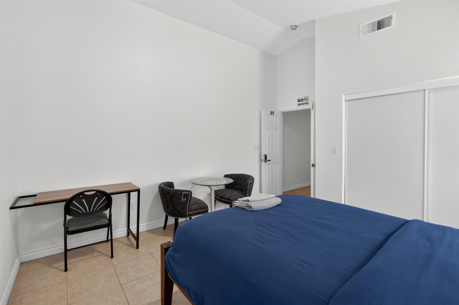8148 Silverleaf Way Sacramento, CA 95829 - Photo 9 of 43 a bedroom with a bed and a table