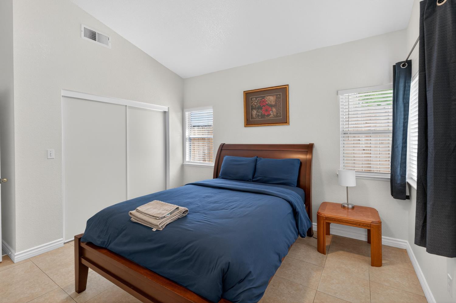 8148 Silverleaf Way Sacramento, CA 95829 - Photo 10 of 43 a bed sitting in a bedroom next to a window