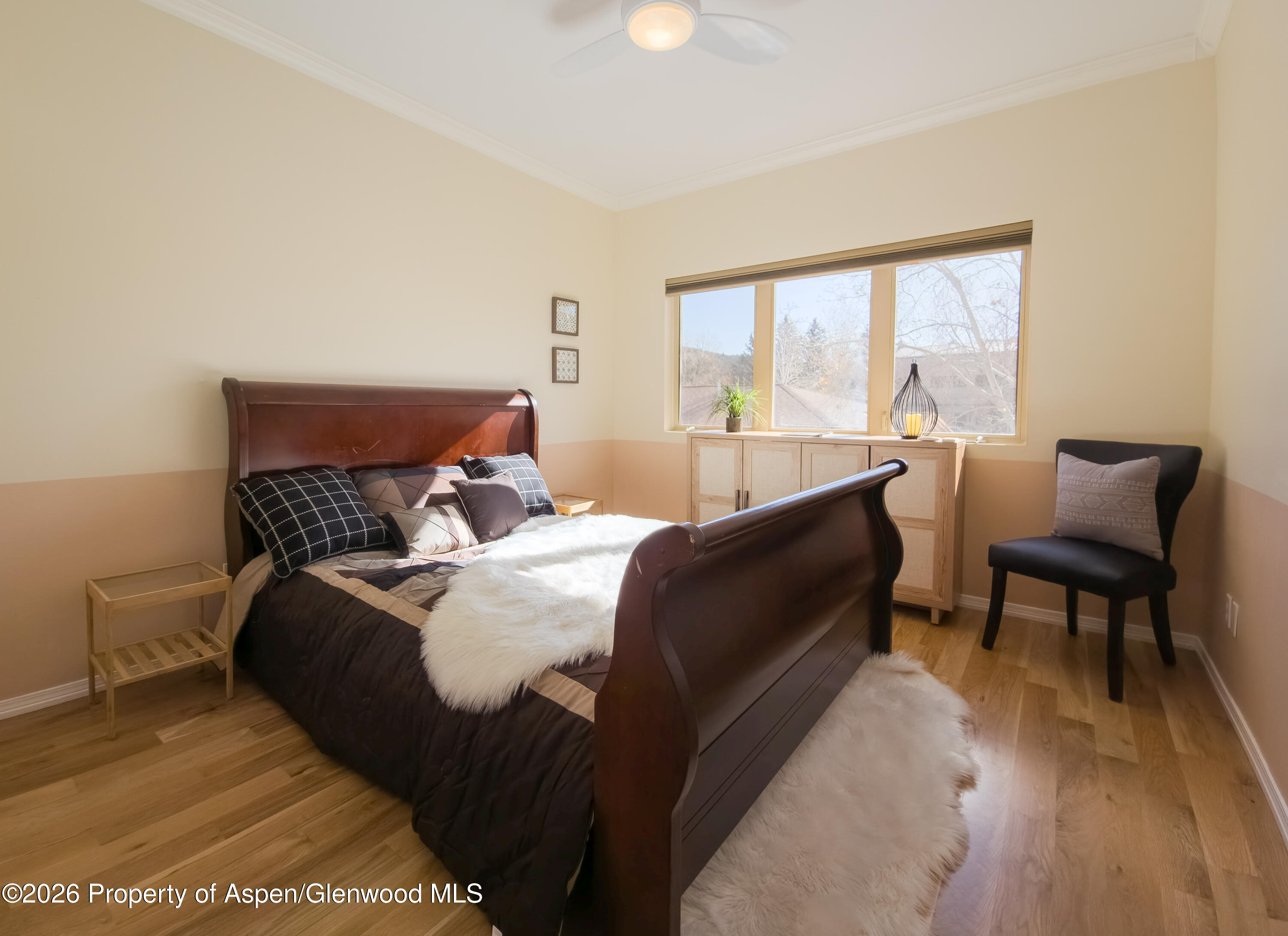 1400 East Valley Road, Unit 212 Basalt, CO 81621 - Photo 2 of 8 a bed room with a bed and a chair
