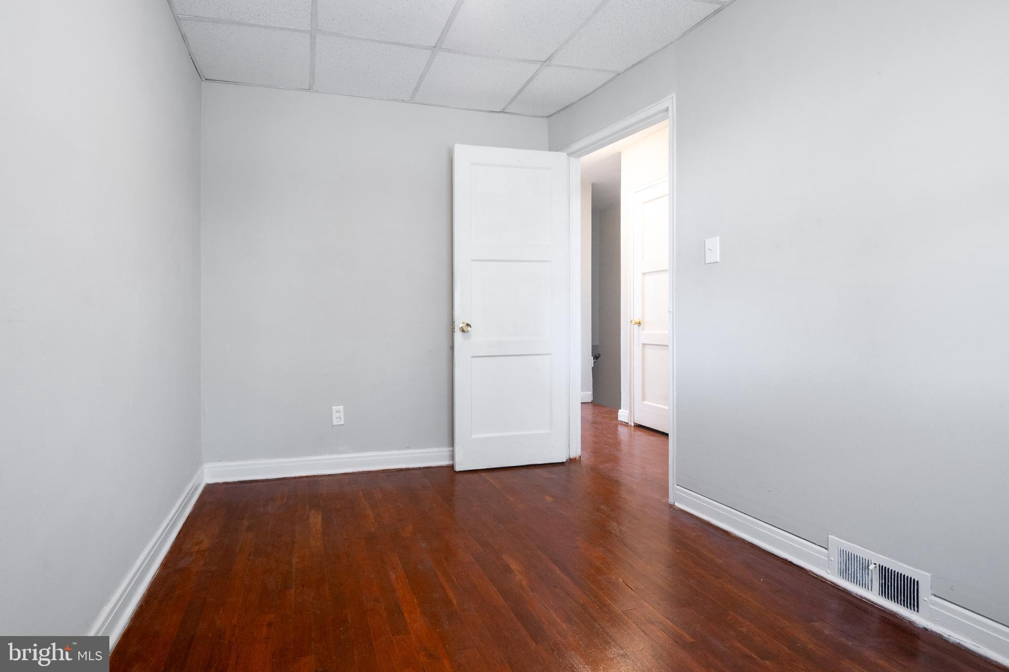 48 Hillvale Road Baltimore, MD 21229 - Photo 21 of 25 a view of an empty room with wooden floor