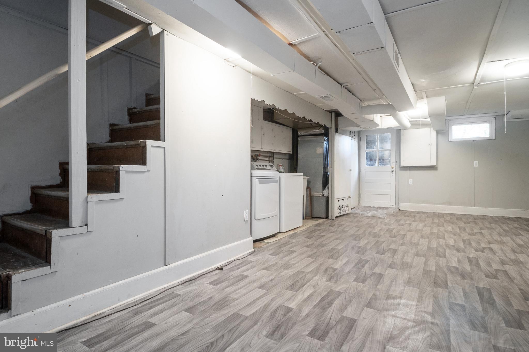 48 Hillvale Road Baltimore, MD 21229 - Photo 22 of 25 a view of a kitchen with a sink and a refrigerator
