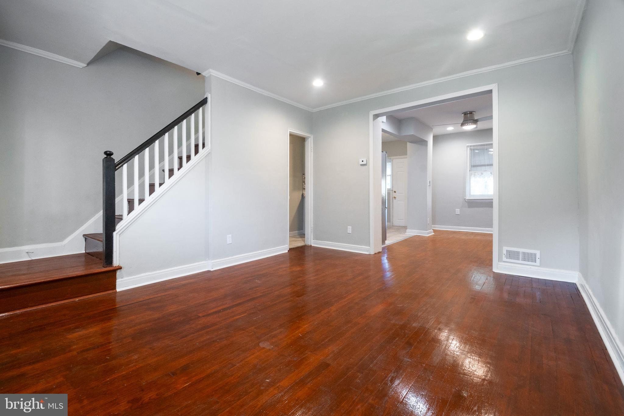 48 Hillvale Road Baltimore, MD 21229 - Photo 5 of 25 a view of an empty room with wooden floor