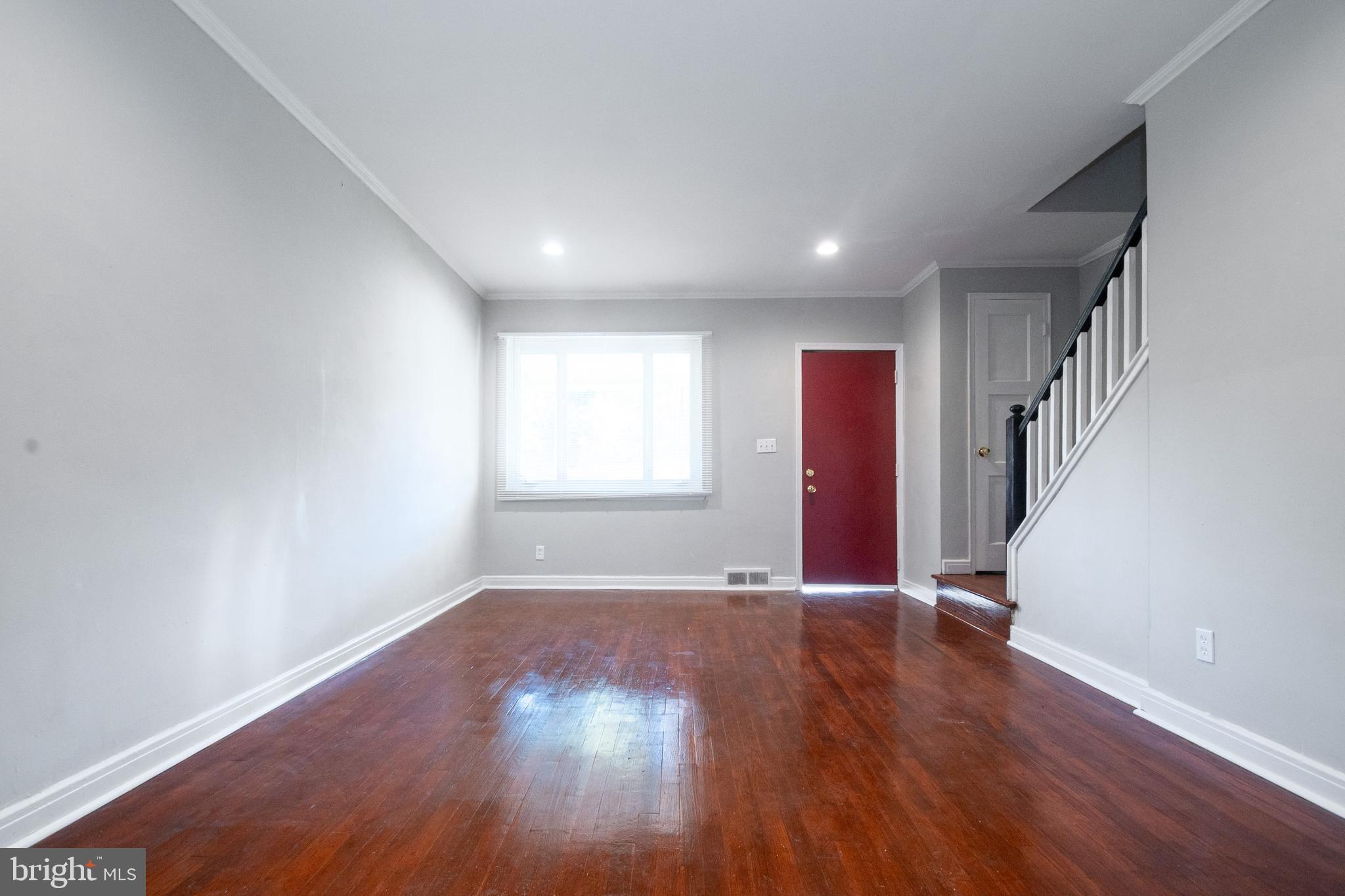 48 Hillvale Road Baltimore, MD 21229 - Photo 7 of 25 wooden floor in an empty room with a window