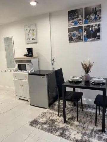 a view of a dining room with furniture