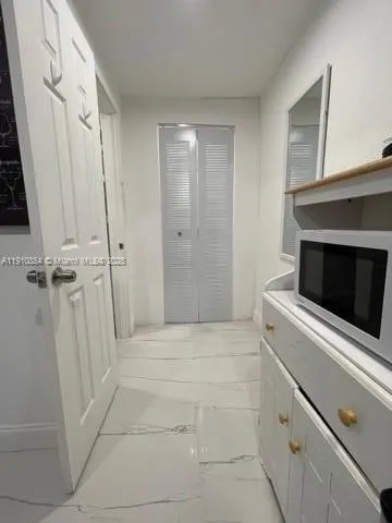 a bathroom with a sink toilet and mirror