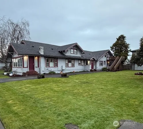 a front view of a house with a garden and porch