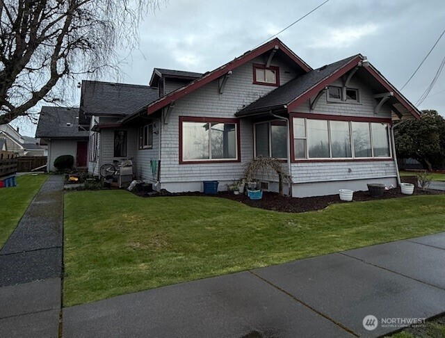 711 N Street Hoquiam, WA 98550 - Photo 2 of 4 a front view of a house with a garden