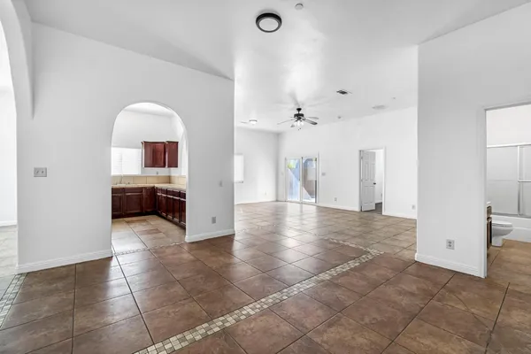 a front view of a house with a yard and a garage