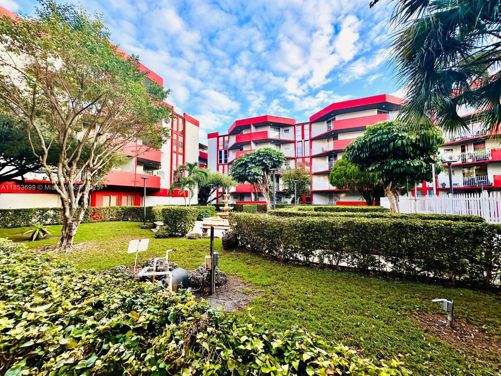 1750 West 46th Street, Unit 535 Hialeah, FL 33012 - Photo 25 of 28 a front view of house with yard and green space
