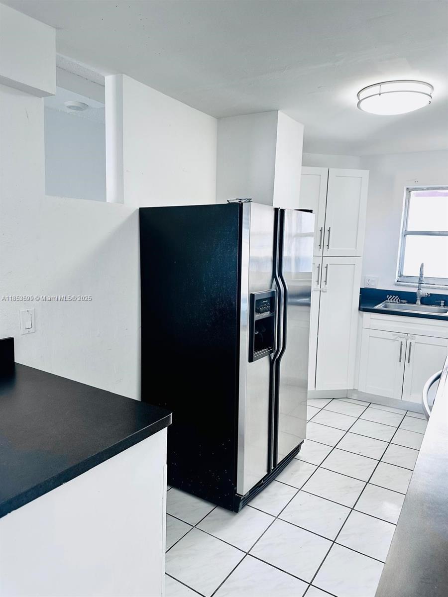 1750 West 46th Street, Unit 535 Hialeah, FL 33012 - Photo 4 of 28 a kitchen with stainless steel appliances a refrigerator and a stove top oven