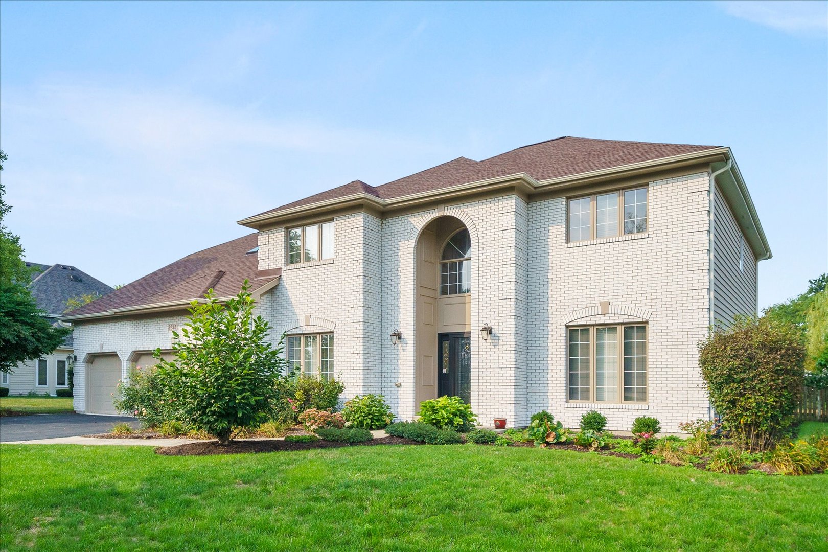 3235 Gateshead Drive Naperville, IL 60564 - Photo 1 of 21 a front view of a house with a garden and plants